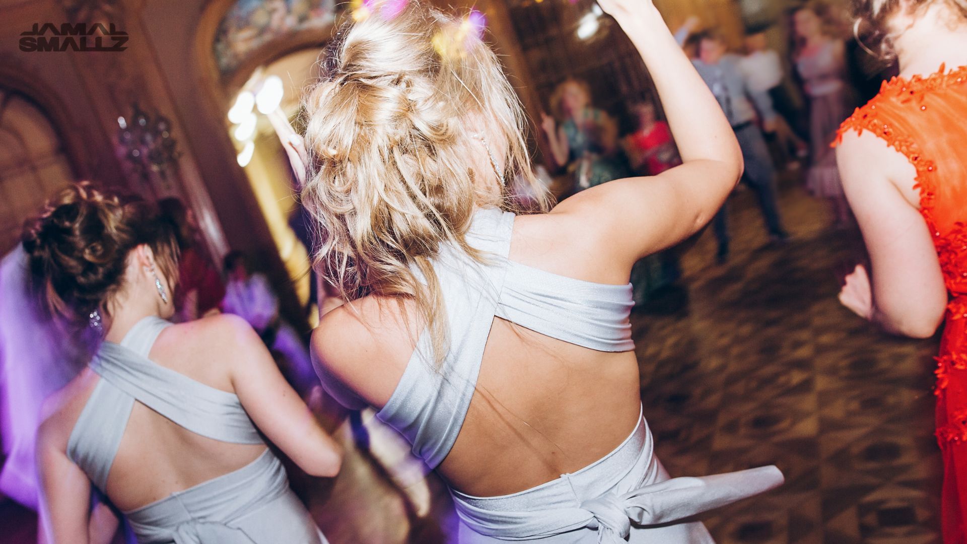 Bridesmaids dancing energetically at a Chicago wedding DJ reception