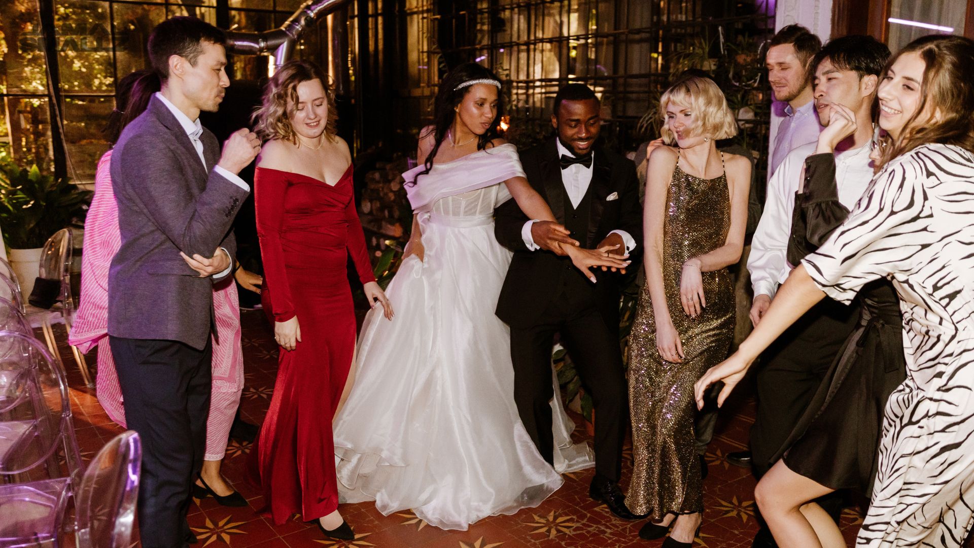 Full wedding reception dance floor under DJ lighting at a Chicago event
