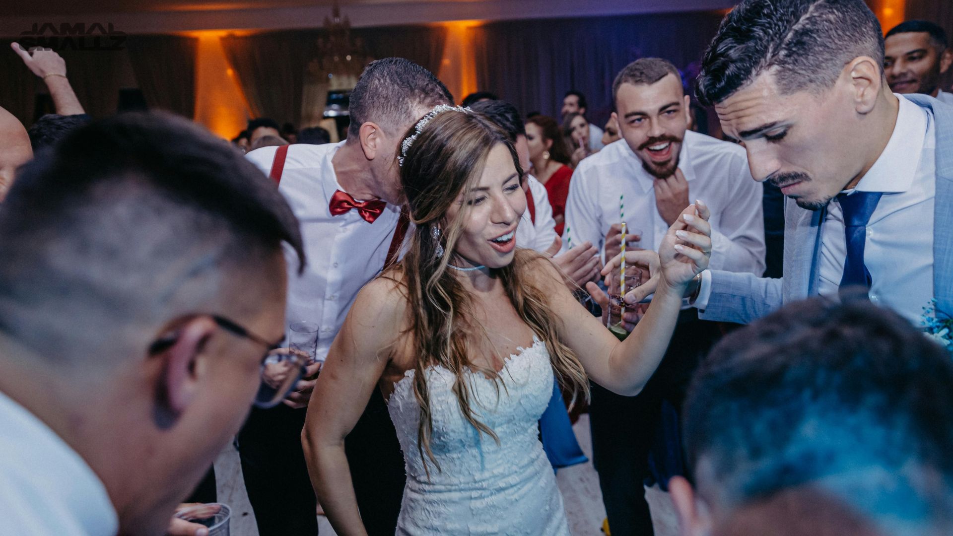 Lively Chicago wedding DJ reception dance party with colorful uplighting